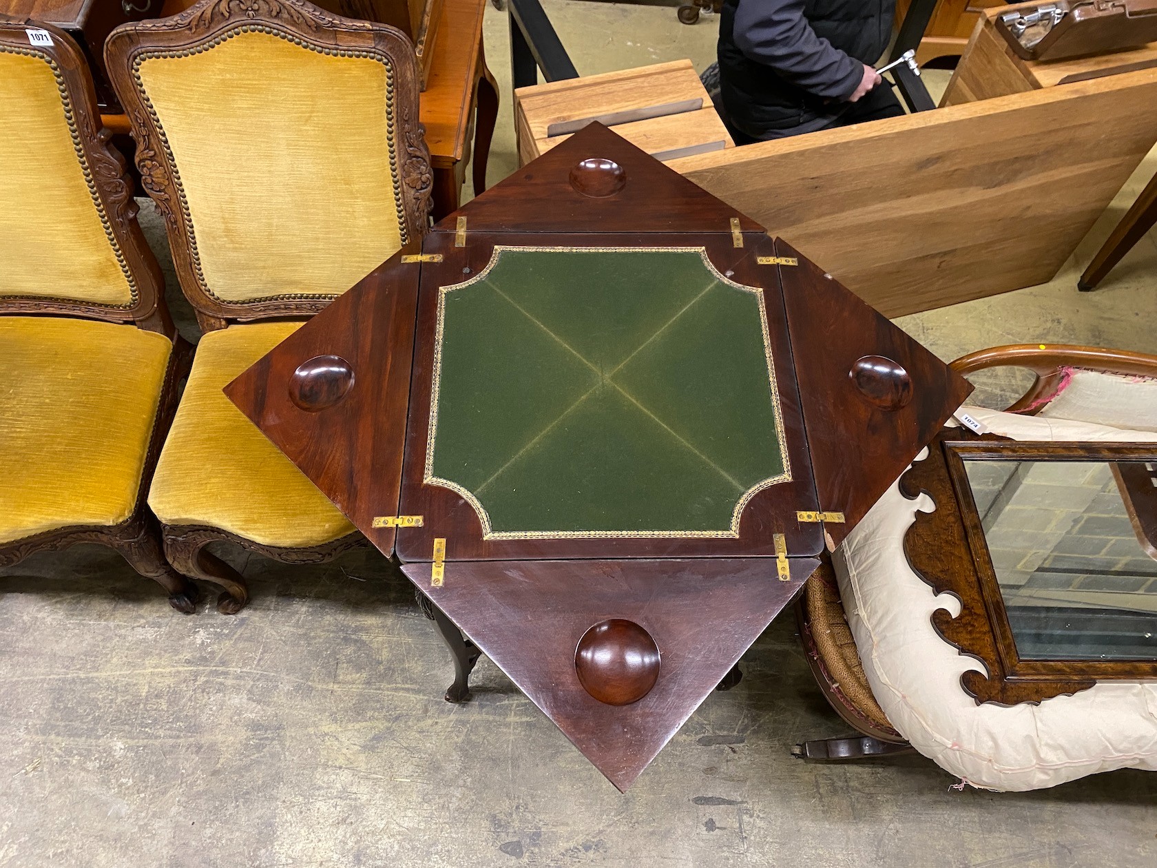 A late Victorian mahogany envelope card table, width 56cm, height 74cm